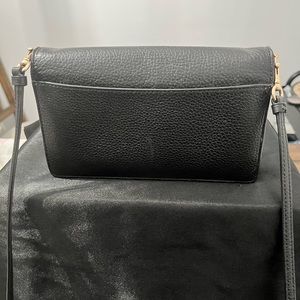 Cross body bag very nice ans slim has pockets inside for your cards .